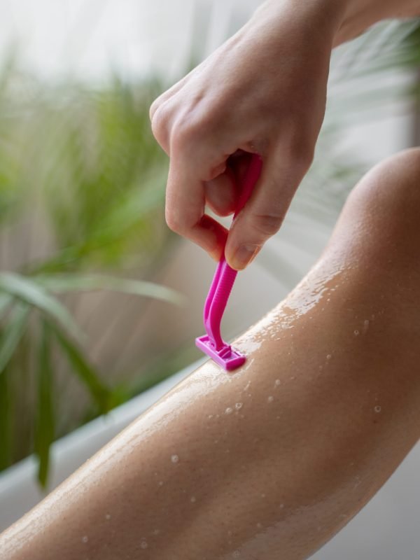 young-woman-preparing-shaving-her-body